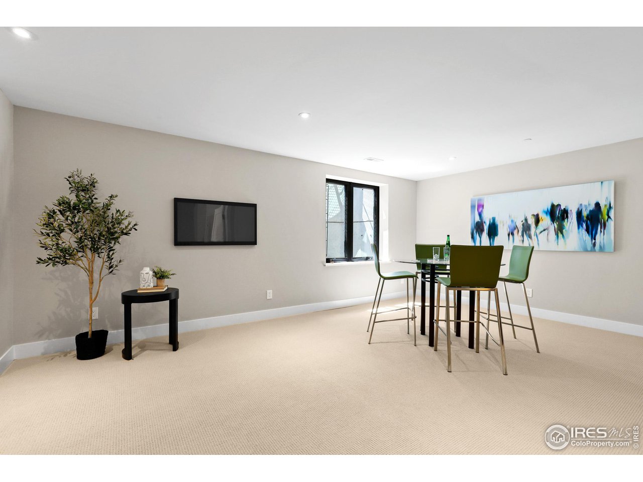 3063 7th Street Boulder, CO 80304 - Photo 29 of 39 a living room with furniture and a flat screen tv
