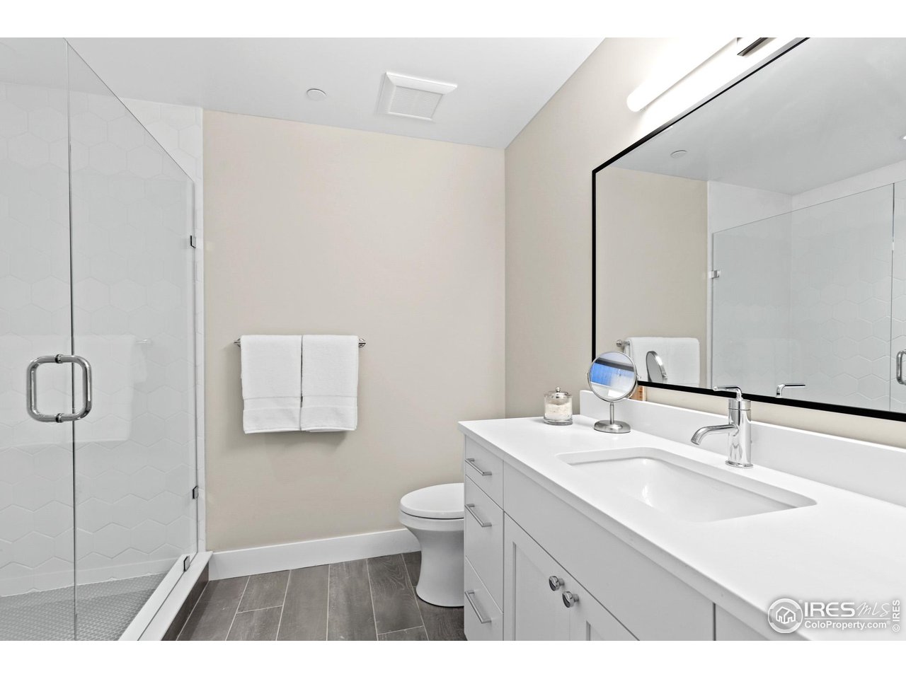 3063 7th Street Boulder, CO 80304 - Photo 30 of 39 a bathroom with a sink a toilet and mirror