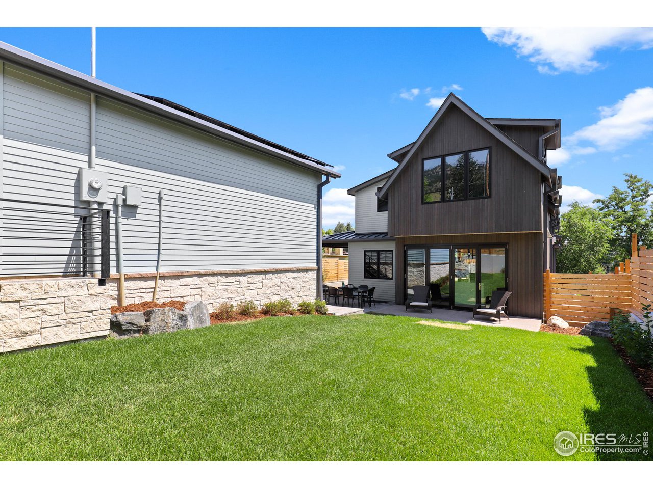 3063 7th Street Boulder, CO 80304 - Photo 31 of 39 a backyard of a house with table and chairs