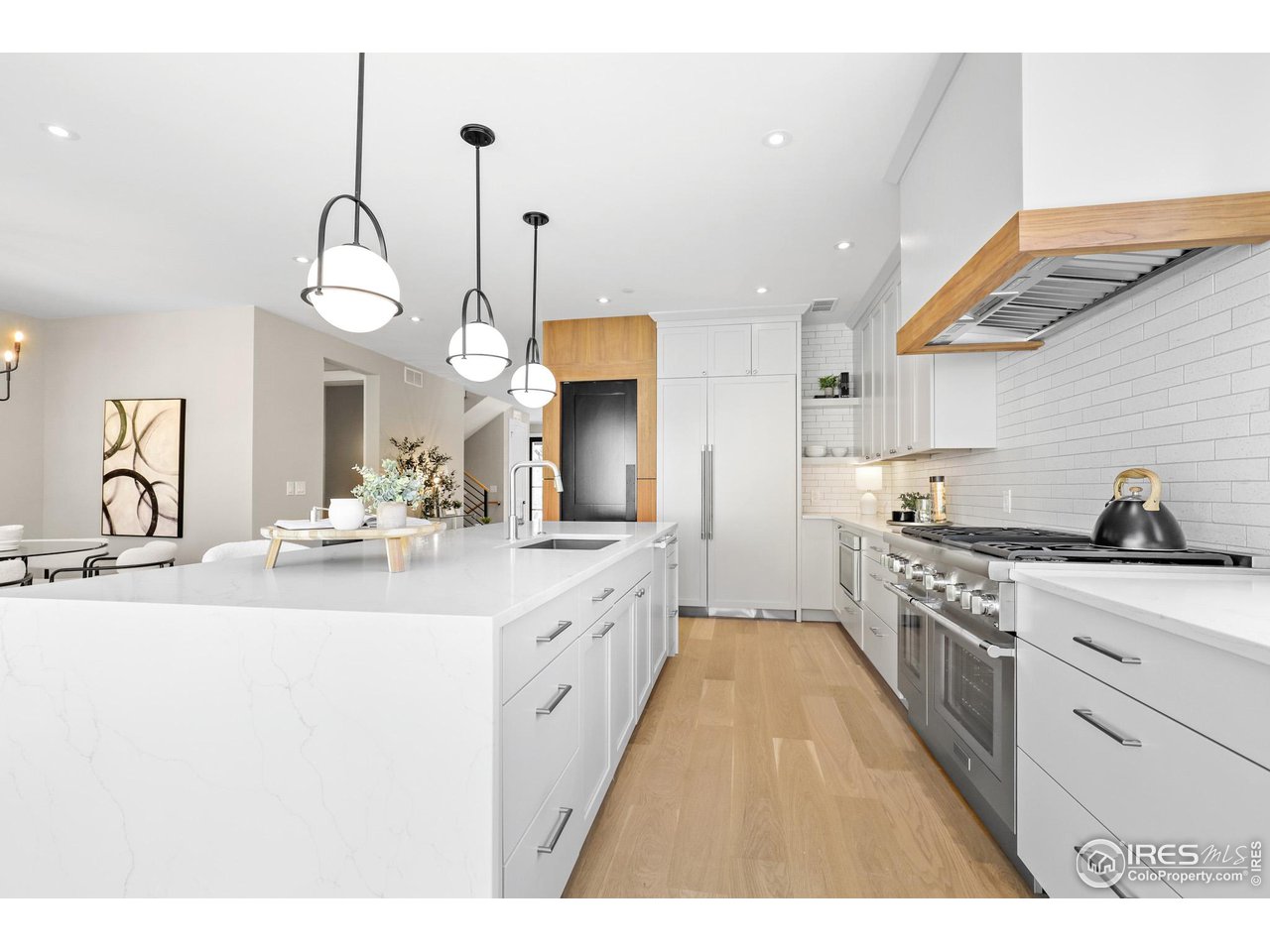 3063 7th Street Boulder, CO 80304 - Photo 5 of 39 a large kitchen with kitchen island a sink appliances and cabinets