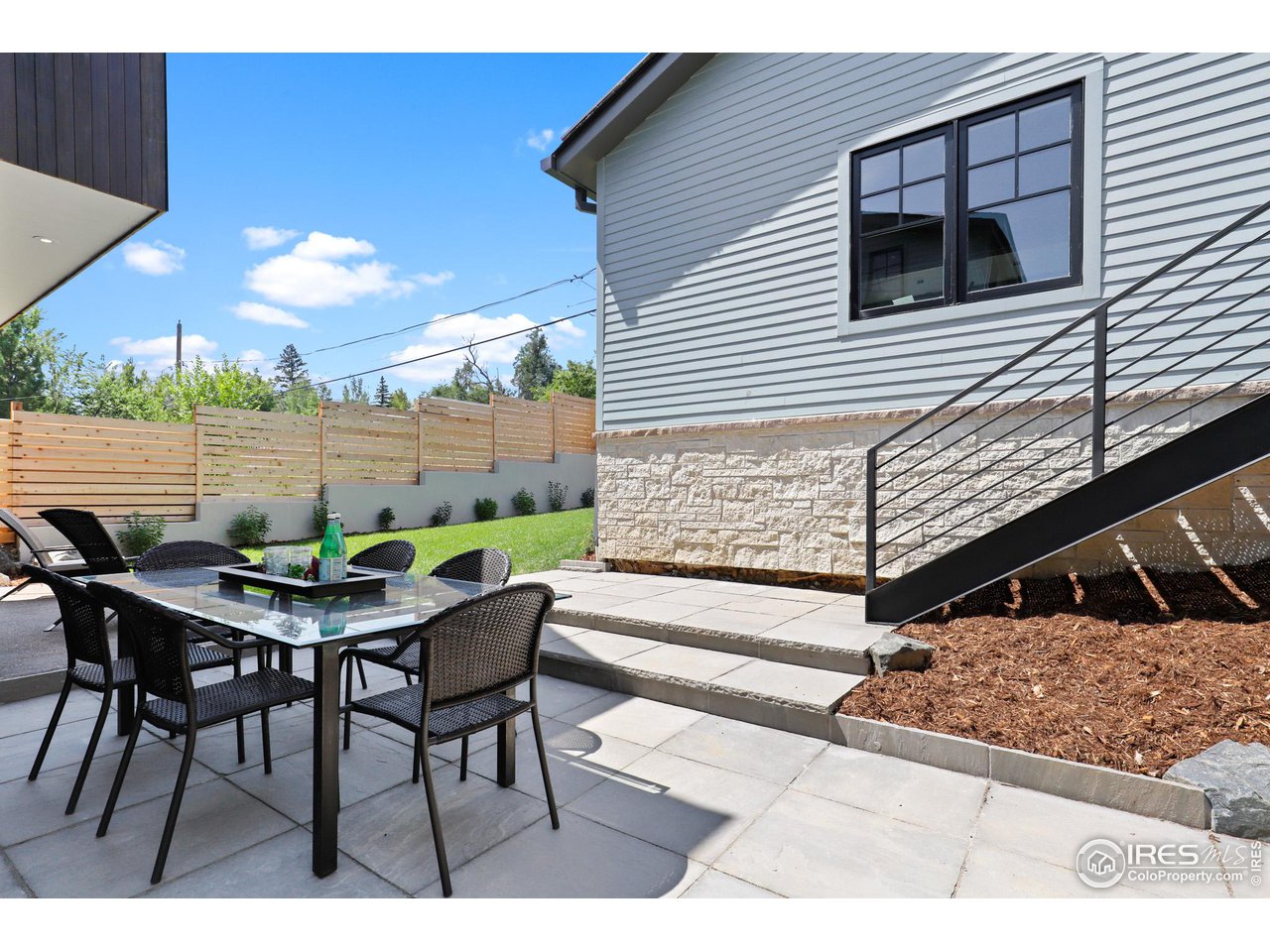 3063 7th Street Boulder, CO 80304 - Photo 7 of 39 a view of a patio with a table and chairs