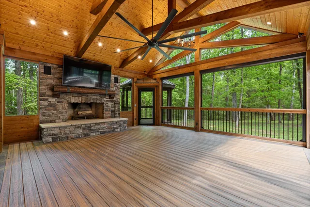 a kitchen with stainless steel appliances granite countertop a sink a stove and a wooden floors
