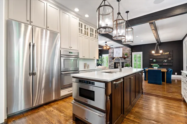 a kitchen with a stove and cabinets