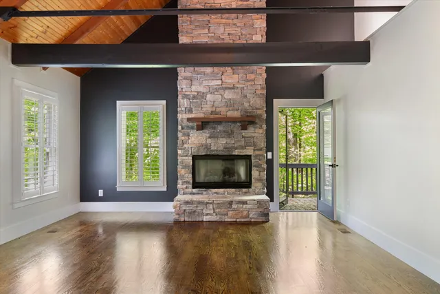 a balcony with wooden floor and fence