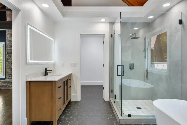 a bathroom with a sink toilet and shower
