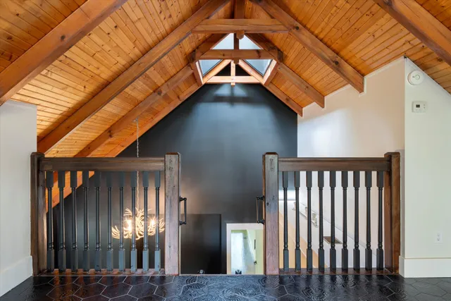 a view of hallway with wooden floor