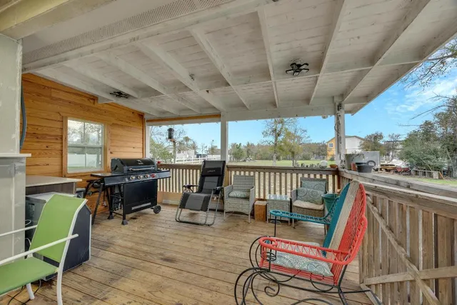 a view of a chair and tables in the balcony