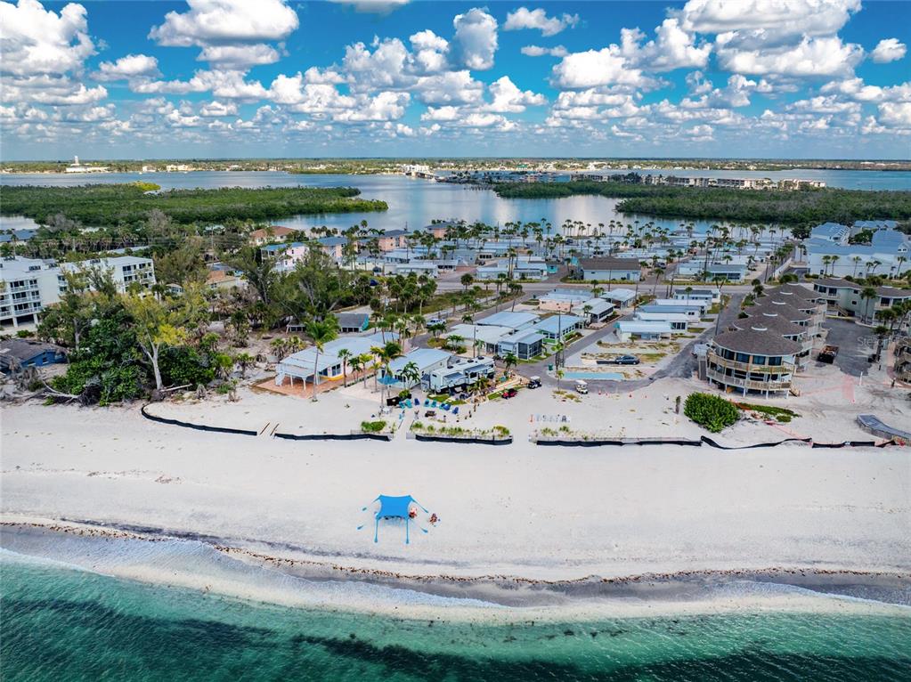 2295 North Beach Road, Unit 22 Englewood, FL 34223 - Photo 3 of 11 a view of a swimming pool with an outdoor seating