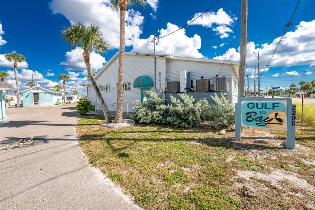 2295 North Beach Road, Unit 22 Englewood, FL 34223 - Photo 7 of 11 a view of a house with backyard and sitting area