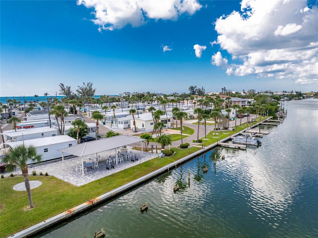 2295 North Beach Road, Unit 22 Englewood, FL 34223 - Photo 8 of 11 a view of a swimming pool with chairs