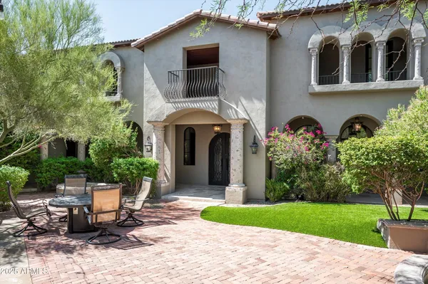 an aerial view of a house with yard swimming pool and outdoor seating