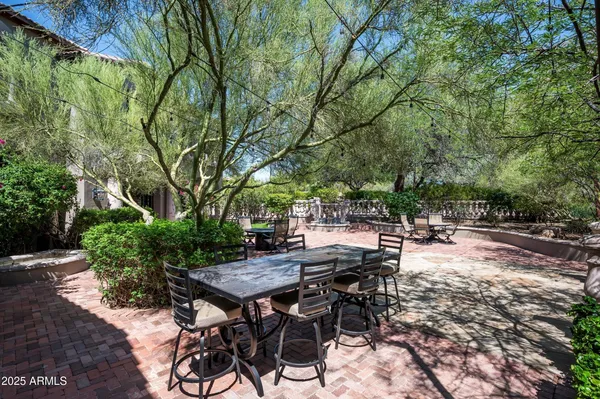 a view of a chairs and tables in patio