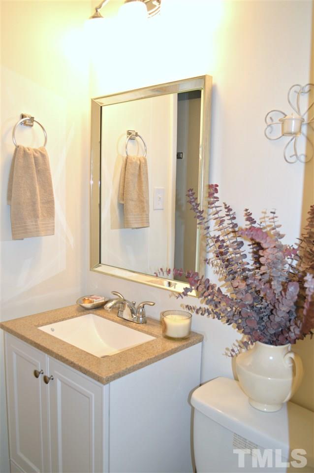 3333 Friar Tuck Road Raleigh, NC 27610 - Photo 18 of 21 a bathroom with a sink and a mirror