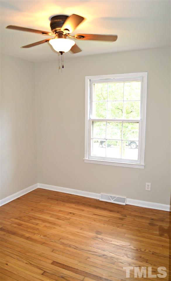 3333 Friar Tuck Road Raleigh, NC 27610 - Photo 20 of 21 a view of a room with wooden floor and a window