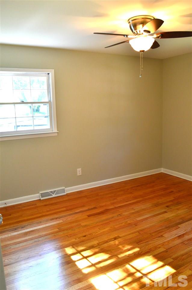 3333 Friar Tuck Road Raleigh, NC 27610 - Photo 21 of 21 a view of a room with wooden floor and a window