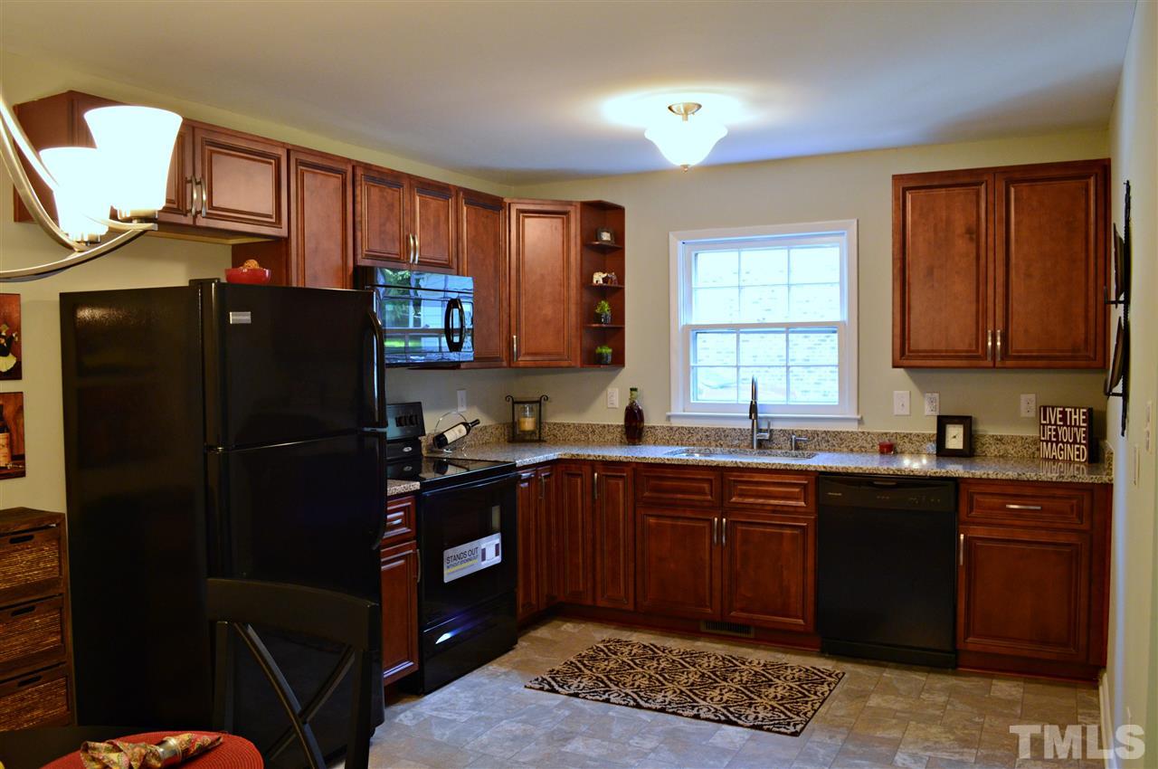 3333 Friar Tuck Road Raleigh, NC 27610 - Photo 9 of 21 a kitchen with stainless steel appliances granite countertop a refrigerator and a sink