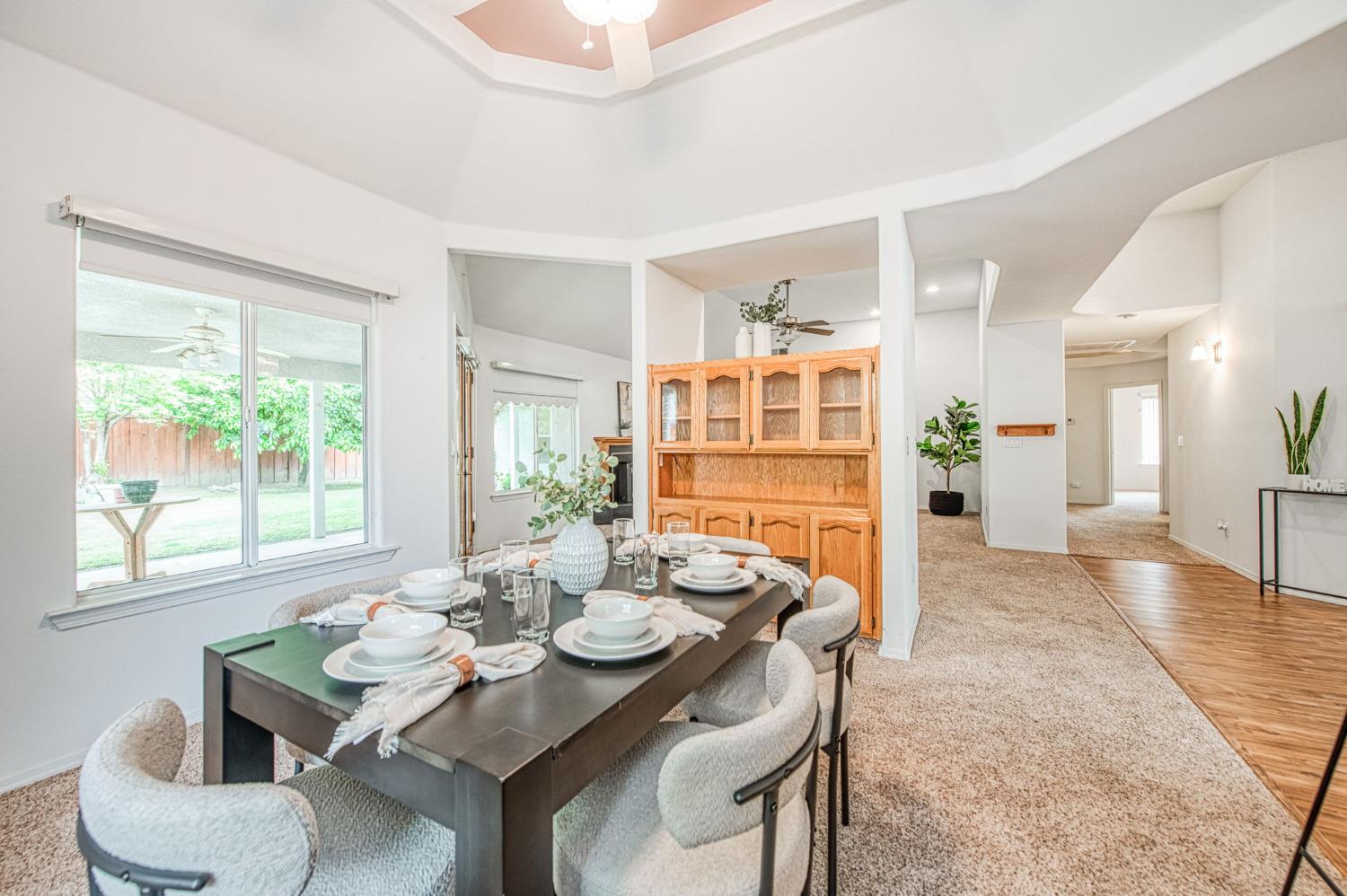 3225 Filbert Avenue Clovis, CA 93611 - Photo 13 of 36 a view of a dining room with furniture window and wooden floor