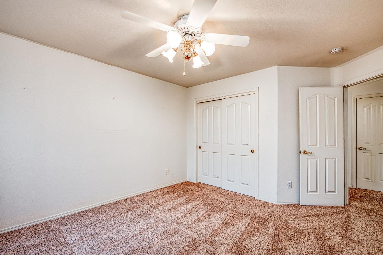 3225 Filbert Avenue Clovis, CA 93611 - Photo 18 of 36 a view of a livingroom with a chandelier fan