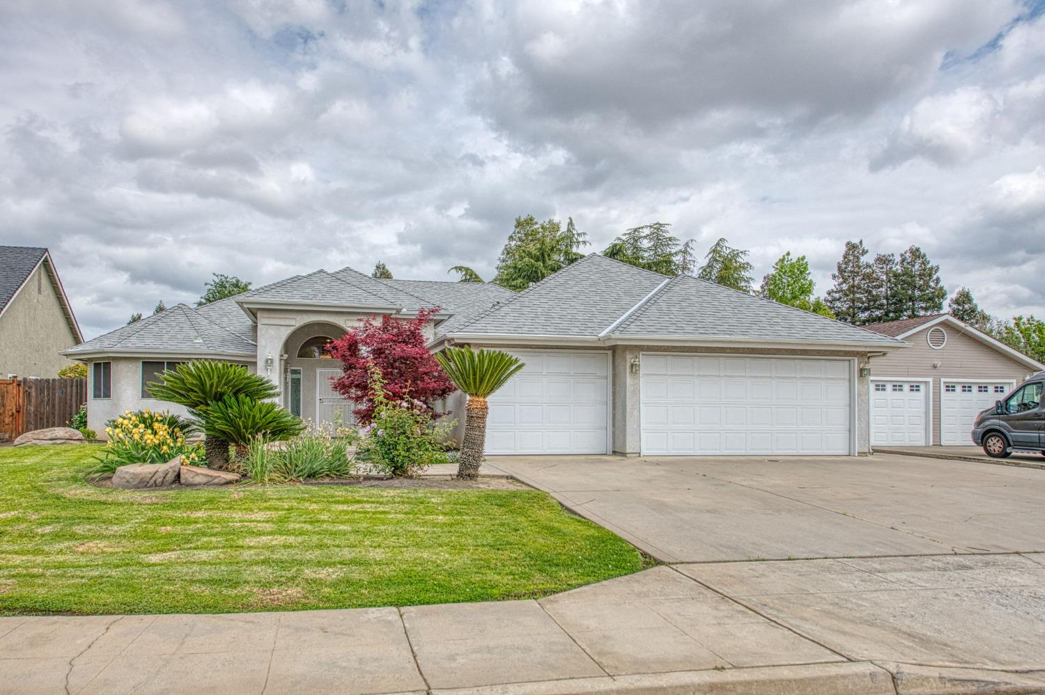 3225 Filbert Avenue Clovis, CA 93611 - Photo 2 of 36 front view of house with a yard