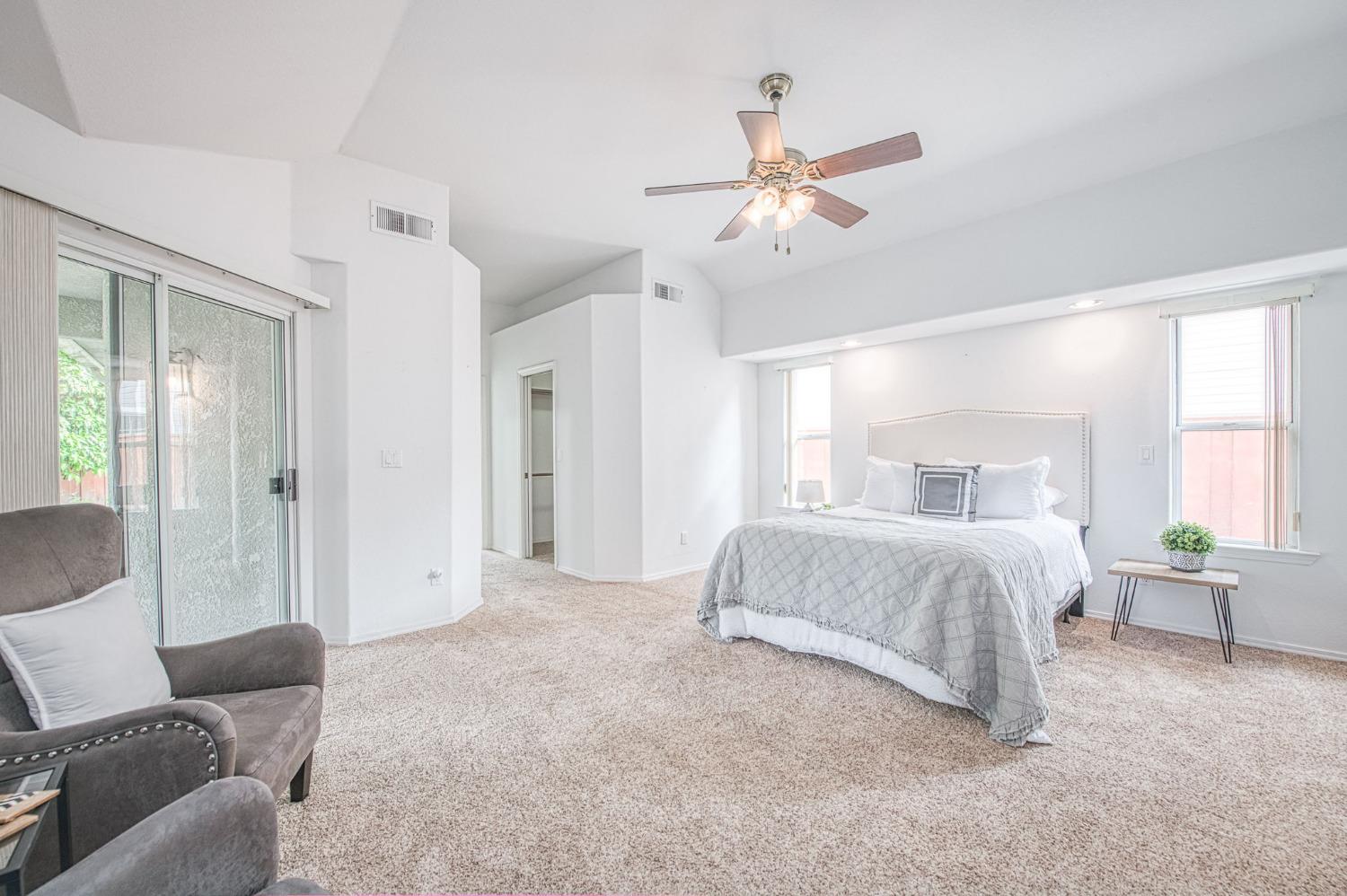 3225 Filbert Avenue Clovis, CA 93611 - Photo 23 of 36 a spacious bedroom with a bed and window