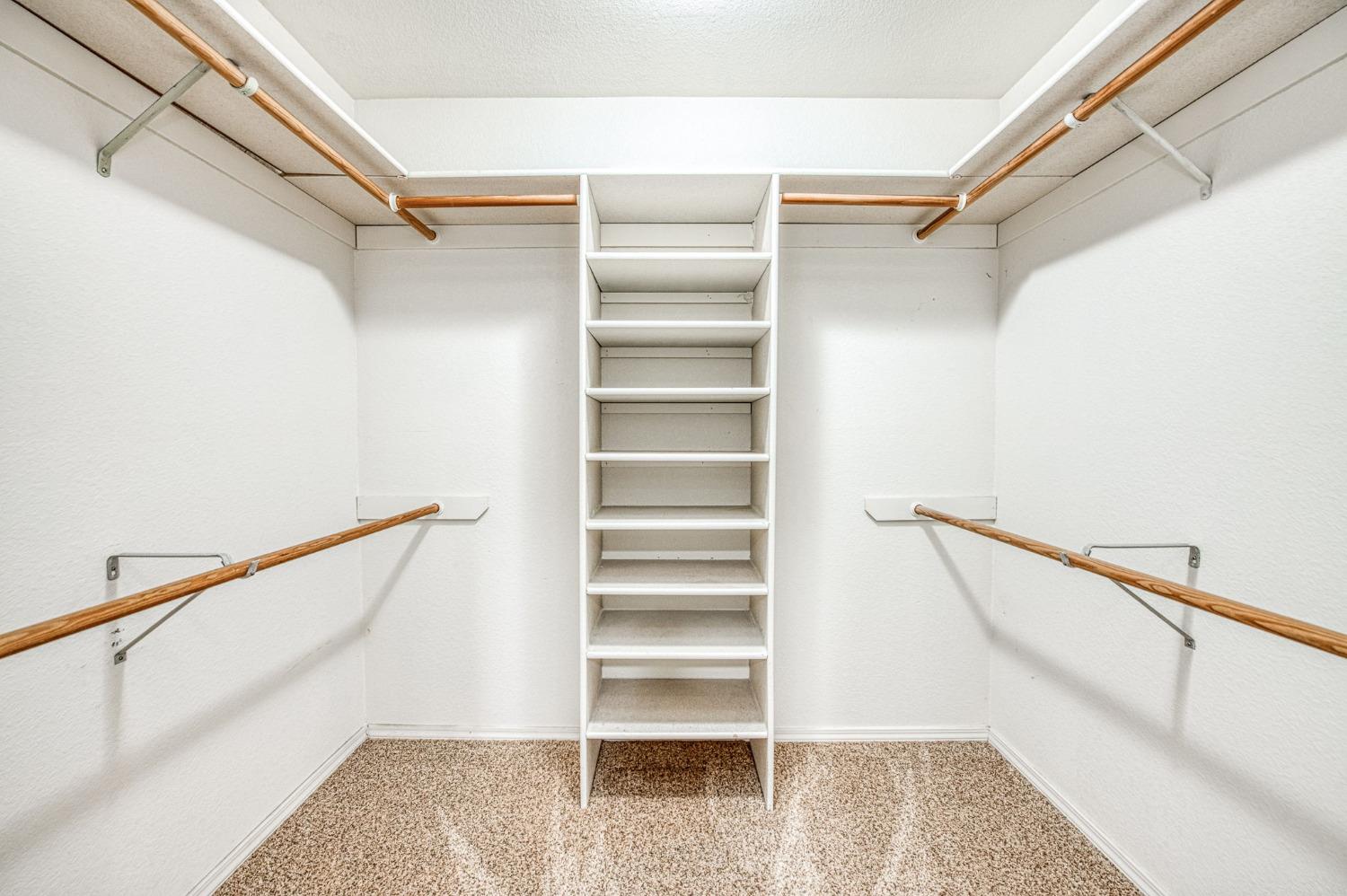 3225 Filbert Avenue Clovis, CA 93611 - Photo 26 of 36 a view of walk in closet with empty racks