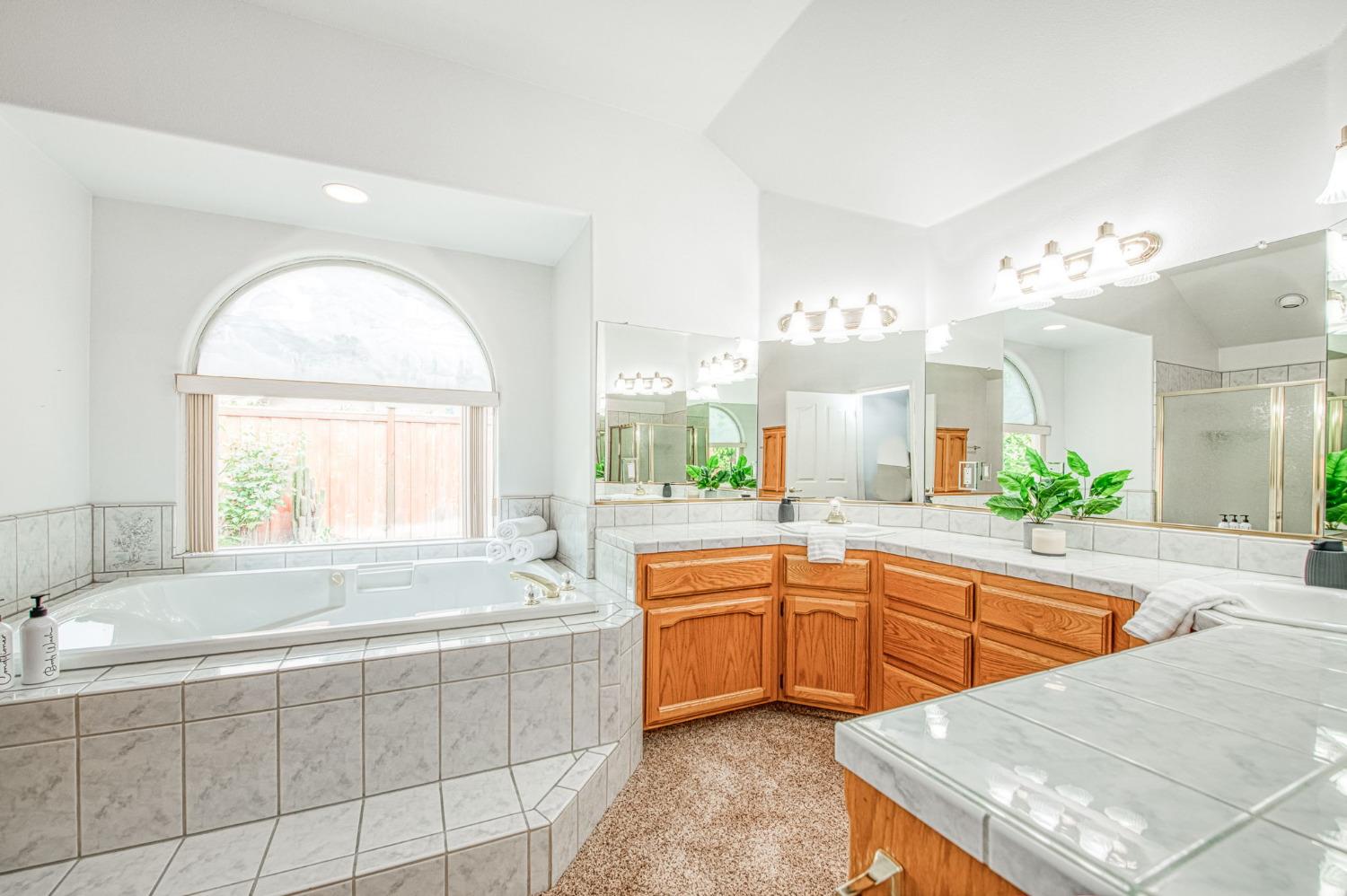 3225 Filbert Avenue Clovis, CA 93611 - Photo 28 of 36 a large bathroom with a large tub and sink