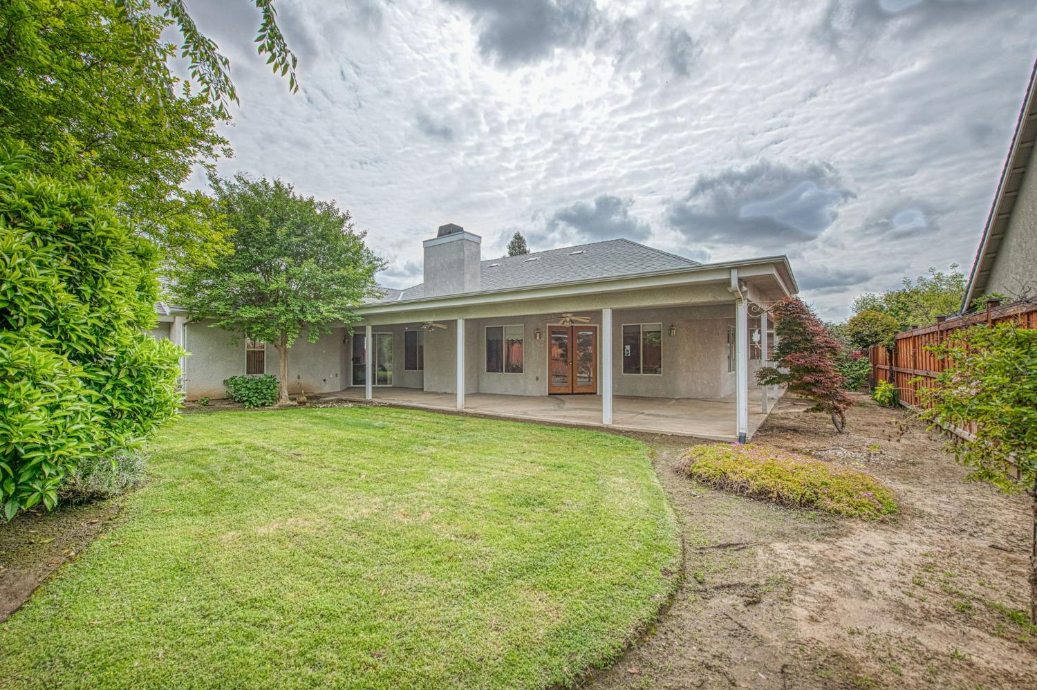 3225 Filbert Avenue Clovis, CA 93611 - Photo 33 of 36 a front view of a house with a garden