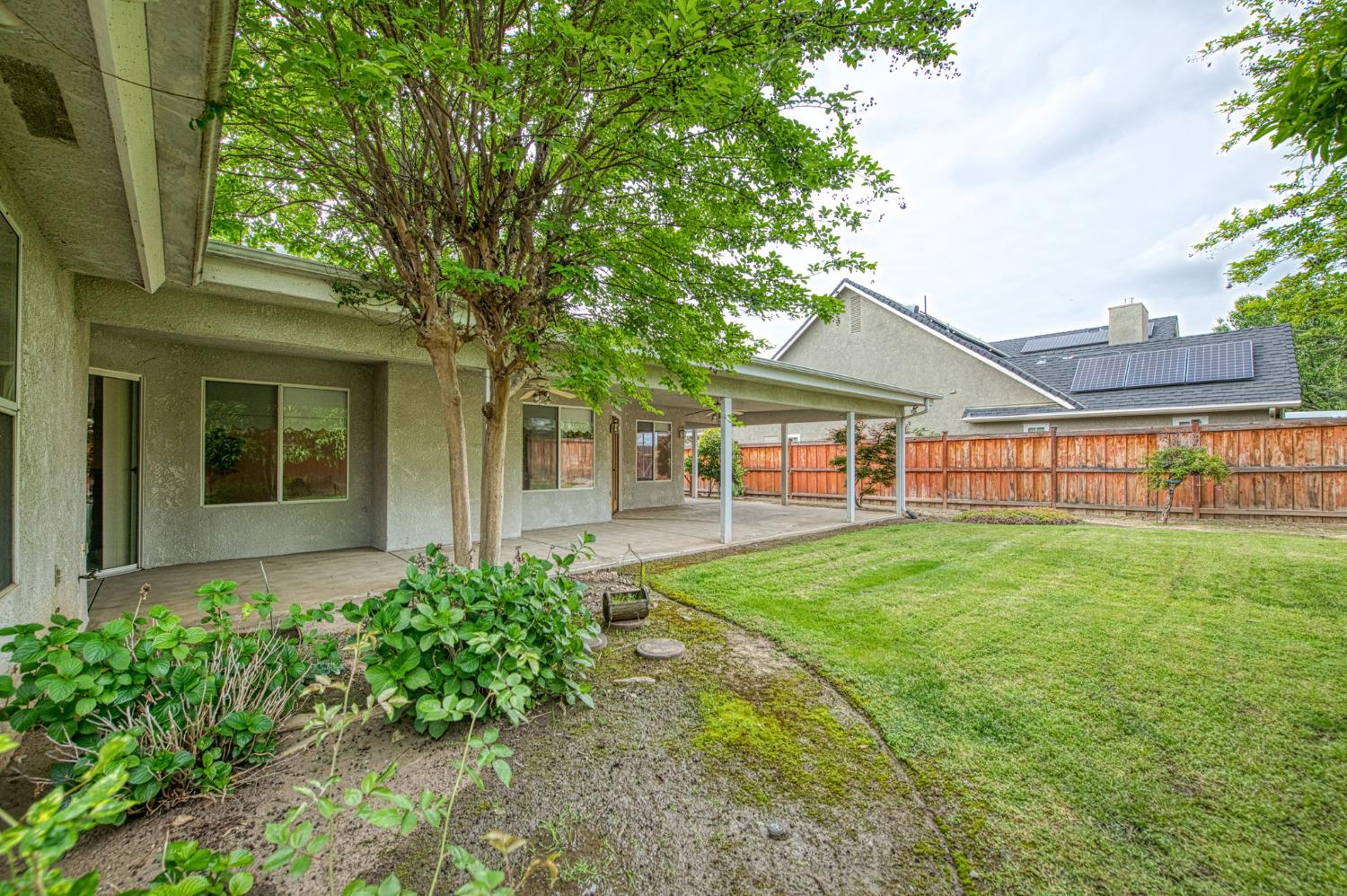 3225 Filbert Avenue Clovis, CA 93611 - Photo 36 of 36 a view of a house with backyard and a tree