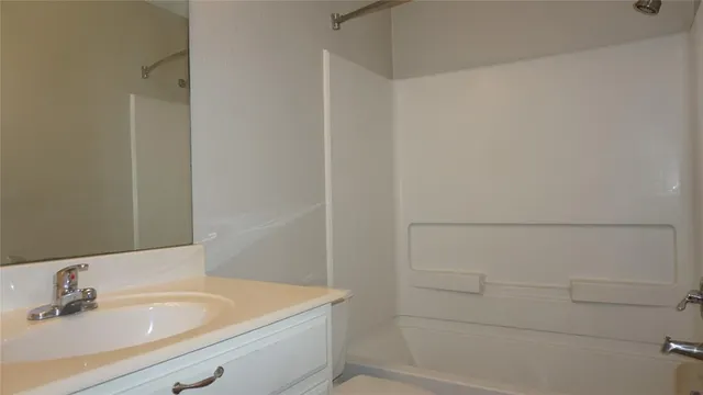a bathroom with a sink and a shower