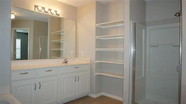 a bathroom with a sink and a mirror