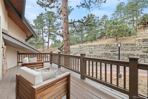 a view of a balcony with furniture