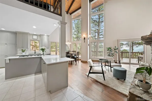 a kitchen with stainless steel appliances granite countertop sink stove and wooden cabinets