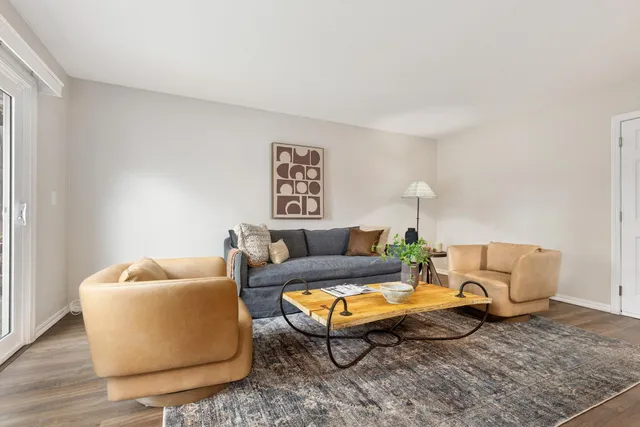 a bedroom with a bed a lamp and a ceiling fan