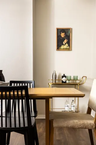 a bedroom with bed and a chandelier