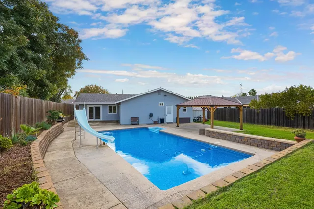 an aerial view of residential houses with outdoor space