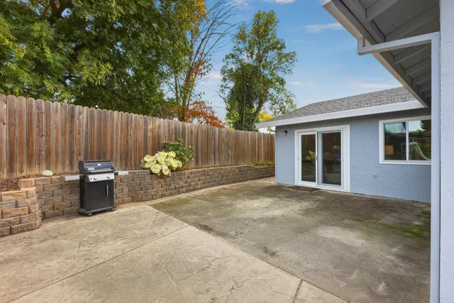 an aerial view of a house with swimming pool garden and patio