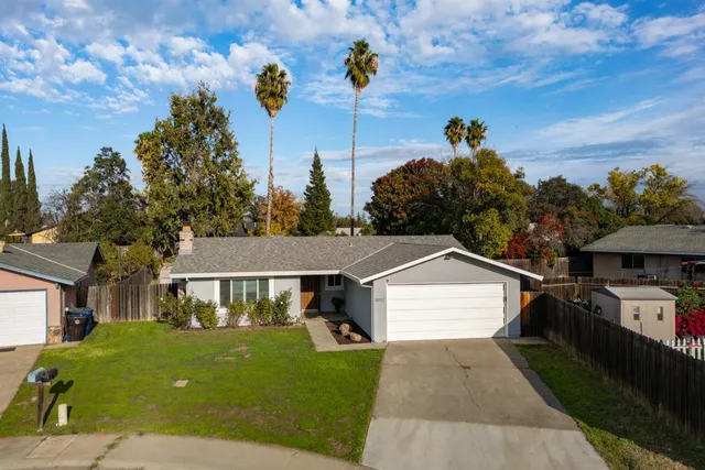 an aerial view of houses with outdoor space