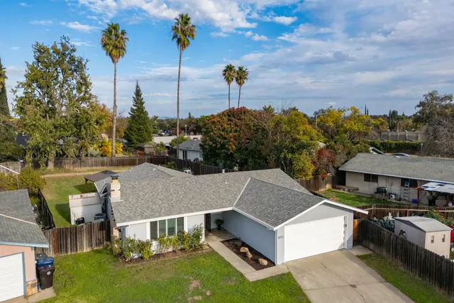 an aerial view of a house with swimming pool