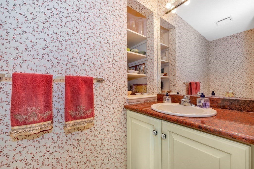 68 Potter Pond, Unit 68 Lexington, MA 02421 - Photo 11 of 28 a bathroom with a sink and a mirror