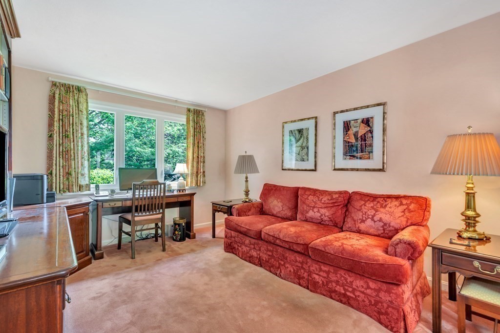 68 Potter Pond, Unit 68 Lexington, MA 02421 - Photo 12 of 28 a living room with furniture and a large window