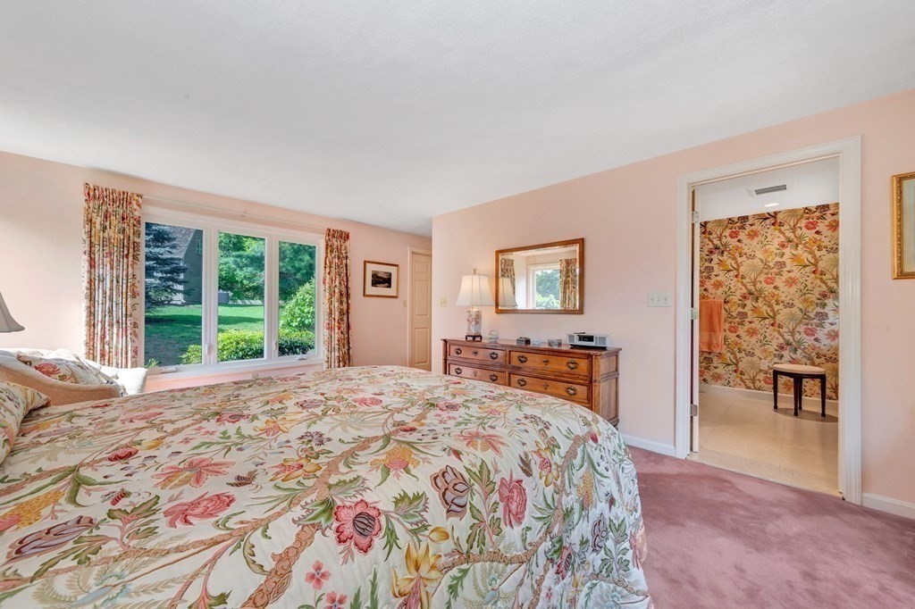 68 Potter Pond, Unit 68 Lexington, MA 02421 - Photo 17 of 28 a bedroom with a large bed and a window