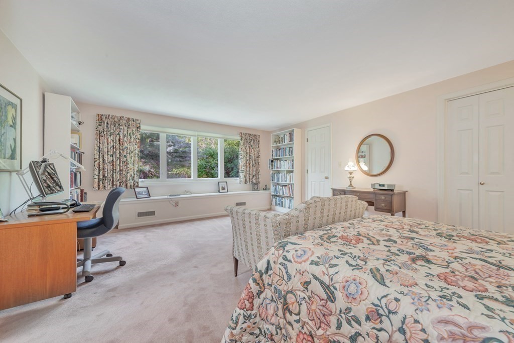 68 Potter Pond, Unit 68 Lexington, MA 02421 - Photo 19 of 28 a bedroom with a large bed and a large window
