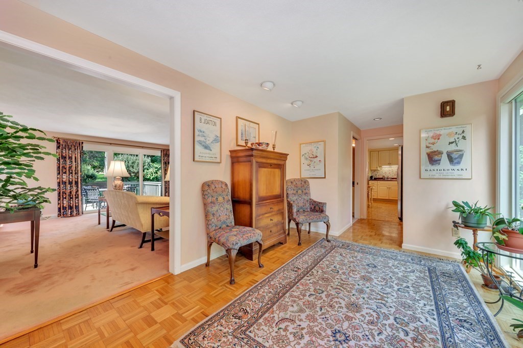 68 Potter Pond, Unit 68 Lexington, MA 02421 - Photo 2 of 28 a living room with furniture and a table