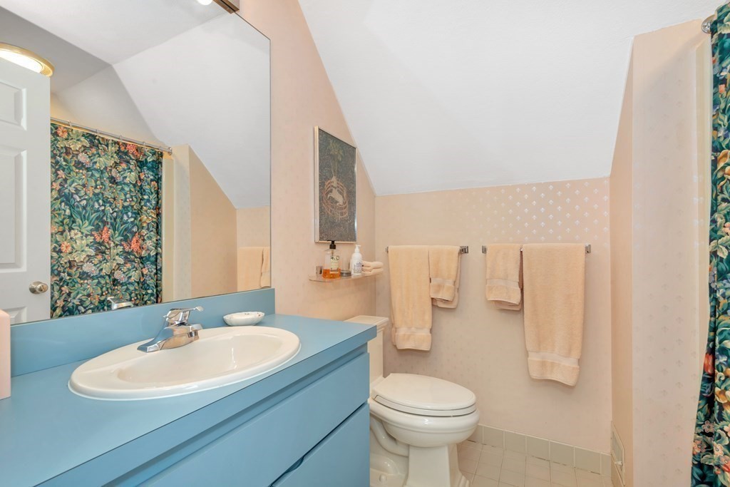 68 Potter Pond, Unit 68 Lexington, MA 02421 - Photo 21 of 28 a bathroom with a sink toilet and mirror
