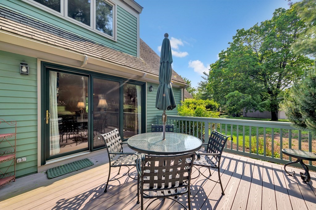 68 Potter Pond, Unit 68 Lexington, MA 02421 - Photo 25 of 28 a view of a patio on the roof deck