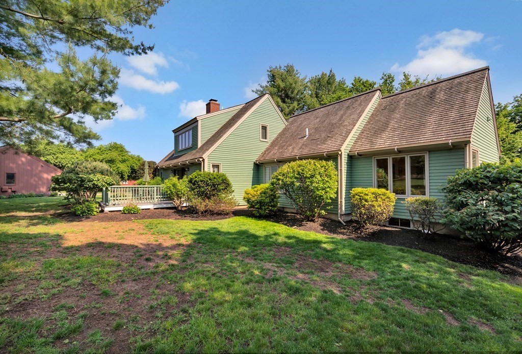 68 Potter Pond, Unit 68 Lexington, MA 02421 - Photo 26 of 28 a front view of house with yard and green space