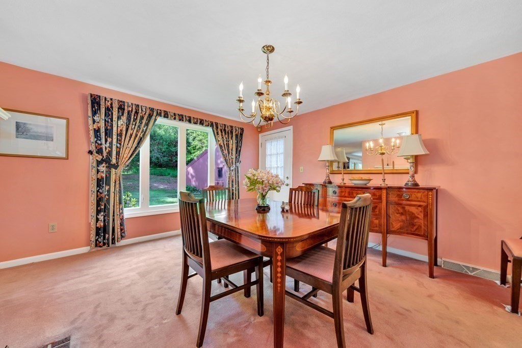 68 Potter Pond, Unit 68 Lexington, MA 02421 - Photo 4 of 28 a view of a dining room with furniture window and outside view