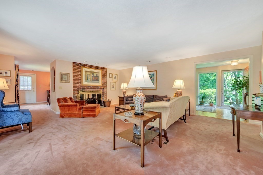 68 Potter Pond, Unit 68 Lexington, MA 02421 - Photo 7 of 28 a living room with furniture and a large window