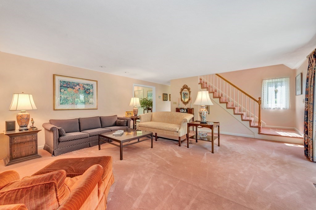 68 Potter Pond, Unit 68 Lexington, MA 02421 - Photo 8 of 28 a living room with furniture and a table