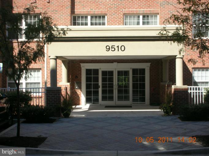 a view of a brick building with large windows
